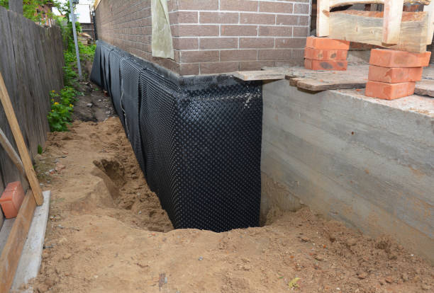 Happy homeowners after waterproofing job in Webberville